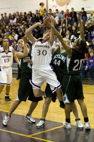 Issaquah’s Erin Nicol gets fouled by Skyline last Friday.