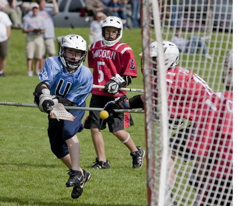 Flames attackman Cody Klansnic rips a shot against the Lincoln goalies off-hand for a score.