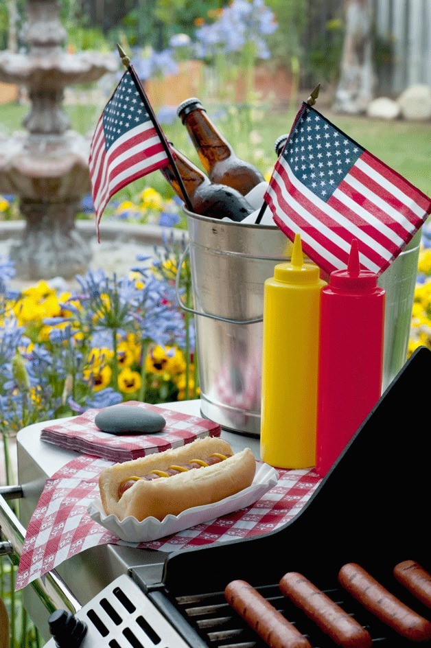 Hotdogs on the grill during the Fourth of July.