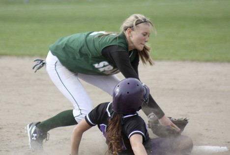Skyline shortstop Lindsey Nicholson lays the tag on Lake Washington's Haley Andrews during the second inning of Monday's game. Catcher Lauren Wolfe and Nicholson hooked up twice to throw out would-be Kangaroo base stealers.