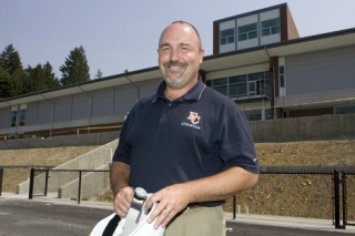 Eastside Catholic athletic director Lance Gatter stands in front of the school's new stadium in Sammamish. By the end of the month
