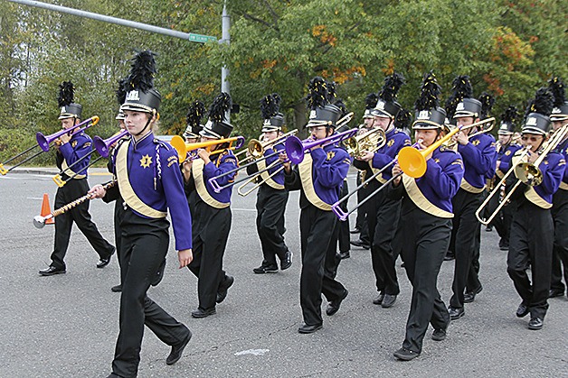 The Issaquah High School Marching Band brings music to Northwest Gilman Boulevard during the Salmon Days Grande Parade on Saturday
