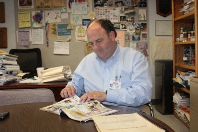 Costco Wholesale Corp. CFO Richard Galanti flips through a Costco Connections magazine in his corporate office in Issaquah. The lifestyle magazine also serves as the company's primary advertising outlet.