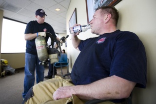 Eastside Fire & Rescue Capt. Donald Turner takes a break after completing the 2009 Scott Firefight Stairclimb on Sunday