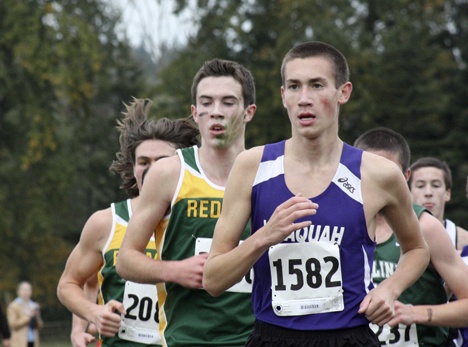 Issaquah's Chris Brasino runs in front of Redmond's Mack Young Thursday afternoon. Young eventually overtook Brasino for first place. Brasino took fifth