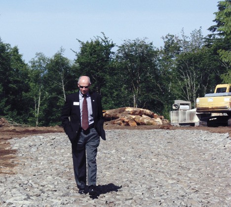 Issaquah School District Superintendent Steve Rasmussen inspects the site of the proposed Elementary 15 on the Sammamish Plateau. E-15