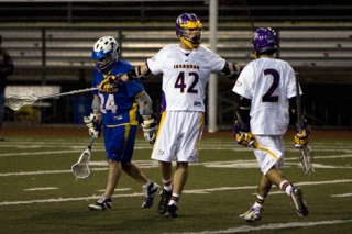 Issaquah’s Kevin Powers  celebrates with teammate Jordan Goldstein after scoring an unassisted goal in the second quarter Tuesday night.