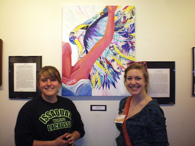Issaquah High School students Jaimie Johnson and Gretchen Allen with the artwork that Allen created