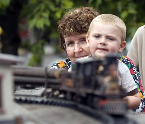 Young J.J. Sawyer gets a lift from his grandmother Cindy Bjorkman so he could get a better look at one of the scale models on display at the Issaquah Train Depot during last year’s show.