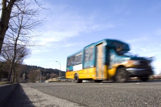 A bus on Route 200 rumbles down Newport Way Northwest in Issaquah. Extending the route is one possible option for bringing bus service to Squak Mountain.