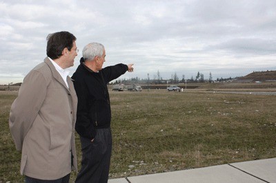 New Port Blakely Communities President René Ancinas and former president and current senior advisor Judd Kirk survey the landscape of a planned mixed-use retail development in the Issaquah Highlands.