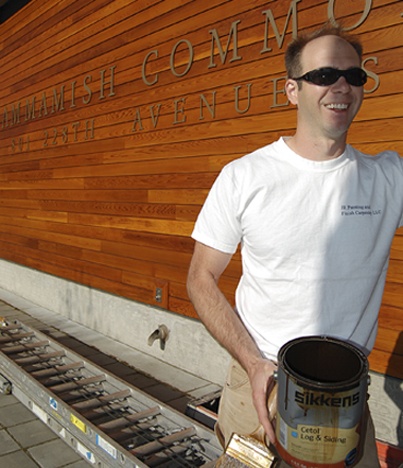 Mike Jaslowski of Fishtail Construction takes a well-earned break during work at the Sammamish City Hall. The local company has recently finished applying an environmentally friendly finish to the hall’s distinctive cedar siding