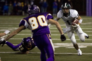 Gino Simone from Skyline turns a short pass from Jake Heaps into a big gain against Issaquah.