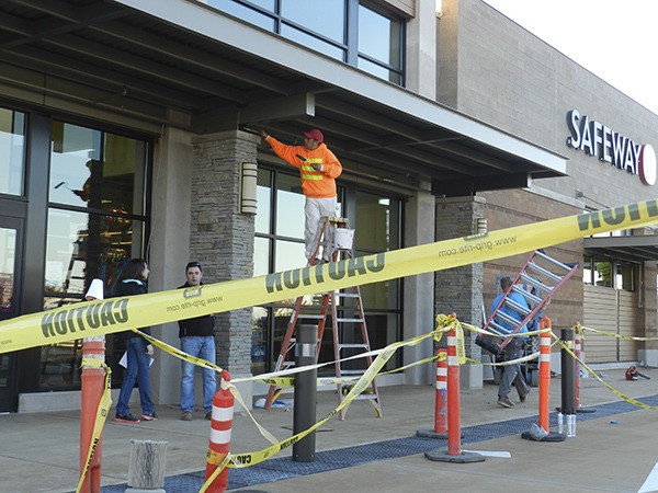 Workers prepare the new Safeway Store in the Issaquah Highlands for its opening Oct. 25.