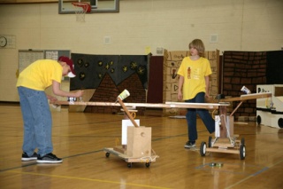 Discovery Elementary School students Vikram Ghangurde and Andrew Blessington work on the manned and unmanned machines the team built for the Destination Imagination “Operation Cooperation” challenge.