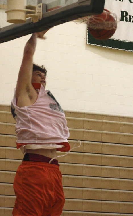 Skyline's Cory Hutsen throws down a one-handed dunk in practice earlier this week. The 6-foot-9 center is expected to be a dominant force in KingCo after averaging 15 points per game last year.