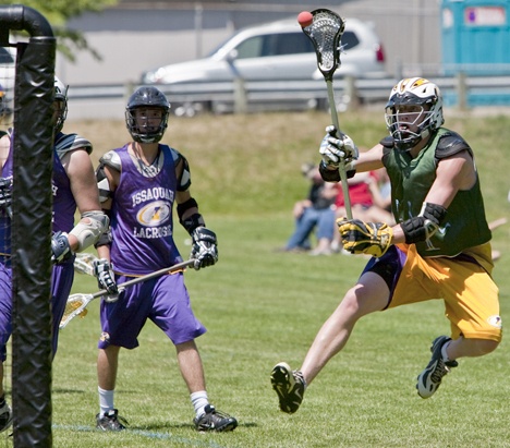 The Sonics’ Jake Fritz makes a leaping shot on goal against the Issy2010 Upperclassmen.