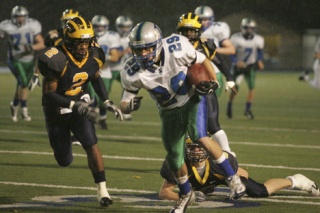 Liberty's Richard Crespo runs away from Bellevue's Jamal Atofau Friday night.