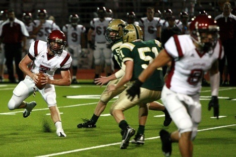 Eastlake quarterback Kelby McCorkle scrambles away from the Redmond defense Friday night.