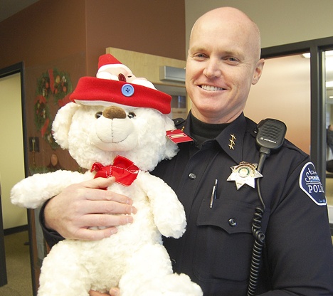 Even tough Sammamish Chief of Police Nate Elledge has a soft spot for cuddly toys. This little bear was one of the hundreds of toys and presents donated by families in Sammamish to the annual Toys for Tots drive.