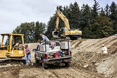 Work crews work on grading for infrastructure in the Kampp subdivision Tuesday