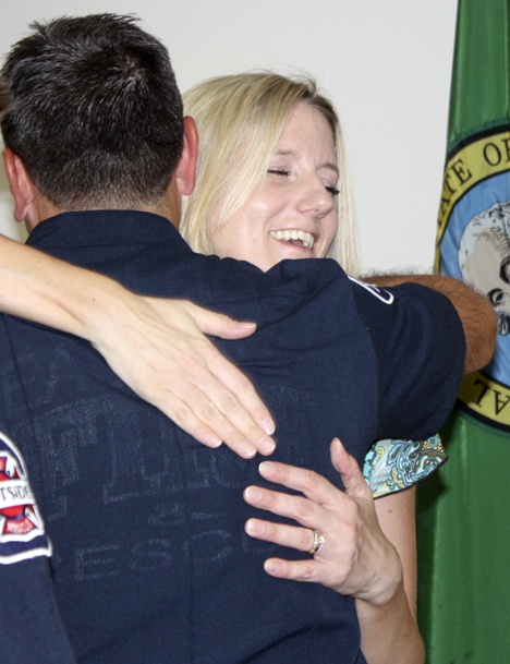 Shannon Holliway hugs Eastside Fire & Rescue fireman Scott Hammack