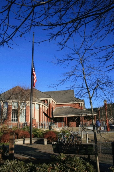 The flag at Issaquah's City Hall and Police Station fly at half mast in honor of four Lakewood police officers