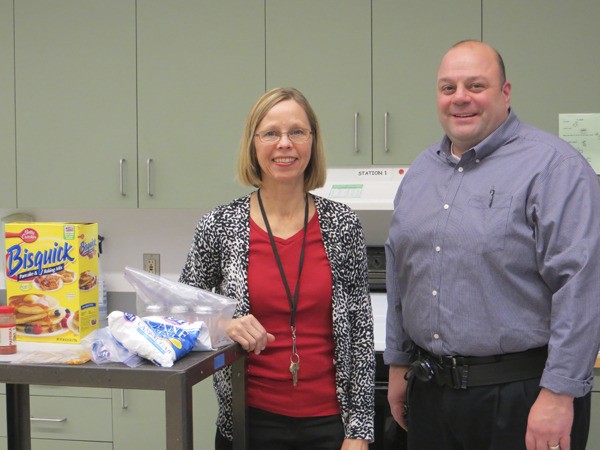 Principal Mike Williams with teacher Pat Barry. Barry teaches family consumer science