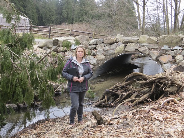 Helen Farrington stands by May Creek