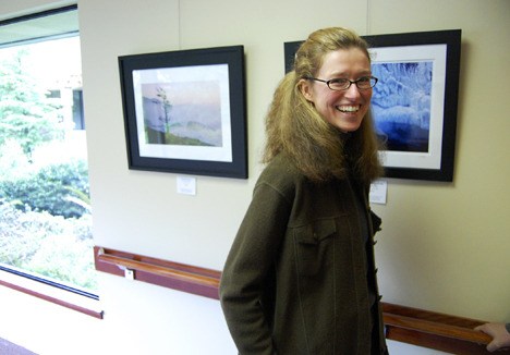 Providence Marianwood Foundation Board Member and local artist Liz Ashley gets ready for the opening of a new show