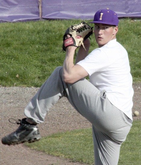 Issaquah relief pitcher Matt Houser works on his delivery Monday afternoon. Houser is one of five Eagle pitchers returning to the mound this season.