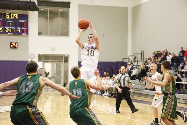 Brian Watson fires a shot in the team's win over Roosevelt earlier this year as sophomore guard Ty Gibson looks on.