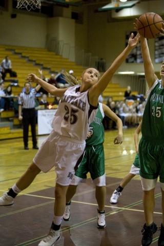 Eastlake's Alyssa Charlston fights for a in a crowd of Woodinville players Monday night.