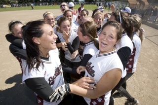The Eastlake fastpitch team celebrates after winning their first-ever state championship.