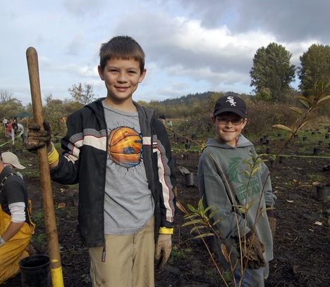 Levi Casto and Jason Mitchell looked like old hands at getting the trees firmly planted. They have been helping the Mountains to Sound Greenway in a campaign to plant more than 25