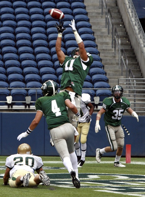 Skyline tight end Cooper Pelluer leaps skyward for a 6-yard touchdown pass from Jake Heaps Saturday against Jesuit.