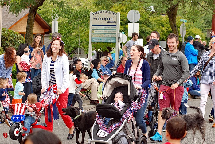 Residents walk down Front Street North during the Issaquah Down Home Fourth of July Kinds 'n' Pets Parade at 11 a.m. on July 4.