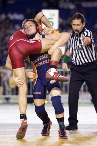 Eastside Catholic's AJ Hostak grapples with Franklin-Pierce's David Kuich in the 3A semifinals. Hostak lost the match in an 8-6 decision after Kuich earned a takedown with three seconds left on the clock.