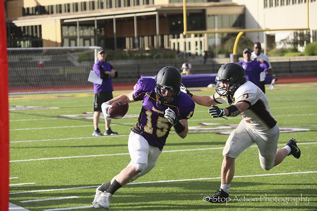 An Issaquah Eagles player makes a move upfield after hauling in a pass during the Issaquah Eagles football team's spring scrimmage on June 16 at Issaquah High School. The Eagles scrimmage came to an end earlier than expected due to inclement weather conditions.