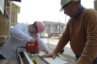 Melissa and Ray Rowe of the Faith United Methodist Church in Issaquah are just two of the many church group volunteers who are helping to continue the work of Habitat for Humanity in East King County.