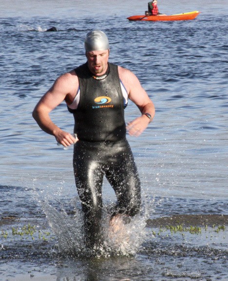 A competitor exits the water during the 2010 Issaquah Triathlon. The event will have its 11th go-around on Saturday