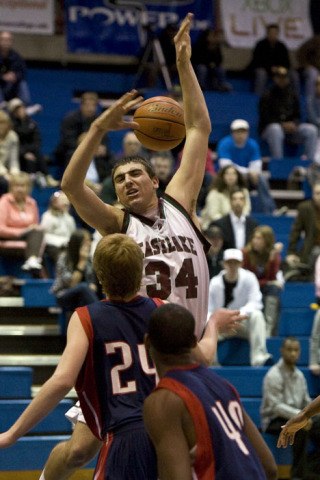 Michale Russo is fouled going up for a shot Monday afternoon against Kennedy. He had a career-high 29 points.