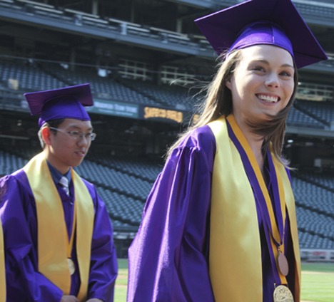 Issaquah High School valedictorians Daniel Yang and Courtney Lester head to the stage at Safeco Field. Taryn Ohashi was also valedictorian.
