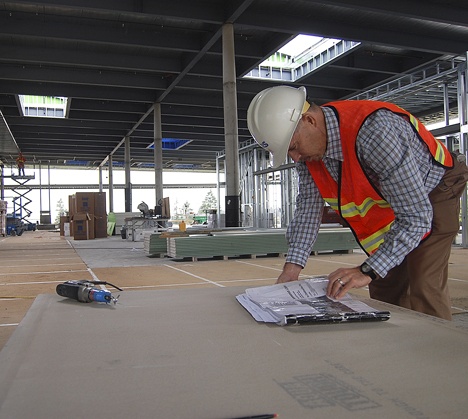 Construction Manager Bob Carns takes a look at plans for the new Sammamish branch of the King County Library