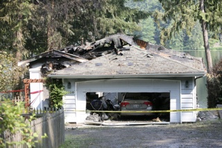The burned remains of the home of congressional candidate Darcy Burner.