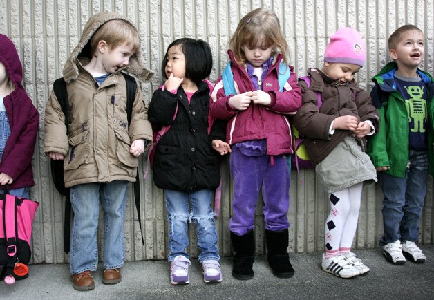 Preschool students line up outside Sunset Elementary School. It's one of three in the district that offers special needs programming before the kindergarten roundup. From the left