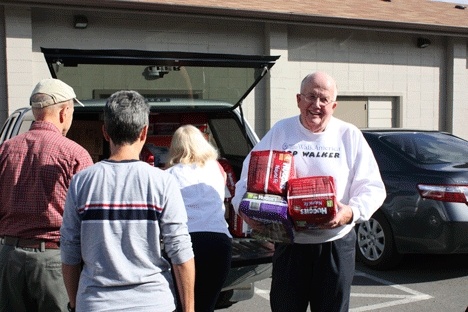 Kirkland resident Bill Petter helps off-load his donation to the Easside Baby Corner. The donation of diapers