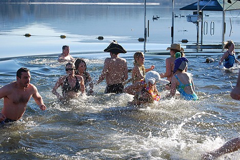 Residents go for a New Year's Day swim at South Cove on Lake Sammamish.