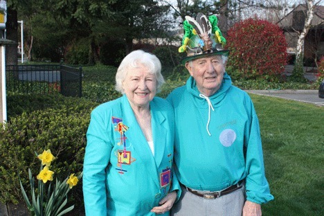 West Lake Sammamish Garden Club members Stephen and Gay Saunders surround themselves with green before the club's St. Pat's day bash.