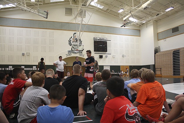 Sammie Henson speaks to a group at Skyline during his wrestling camp.